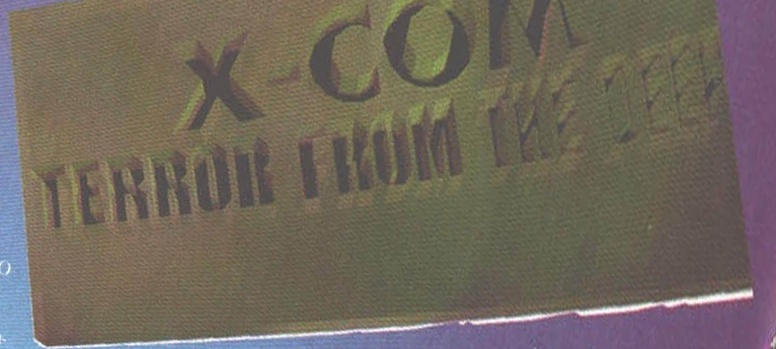 X-COM: TERROR FROM THE DEEP — sigla, tipărită înclinat pe pagină
