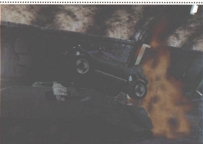 Cyberia 2 — a car flipping over a burning barricade