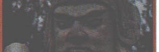 Close-up portrait of a bearded warlord character, next to the VERDICT text column