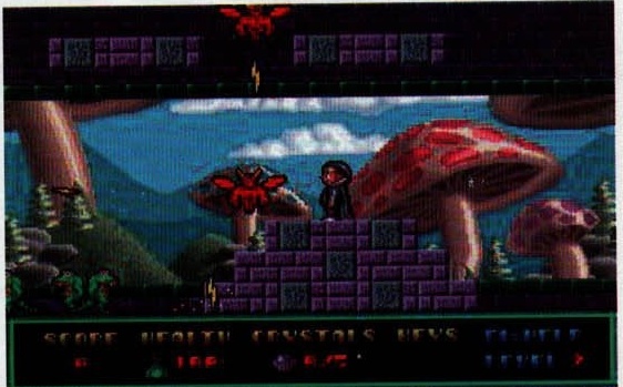 Imagine din Hocus Pocus: peisajul cu ciuperci, cu bara SCORE / HEALTH / CRYSTALS / KEYS. Legenda din pagină: „Ciupercuțe pe câmpii, hai să jumpăim copii."