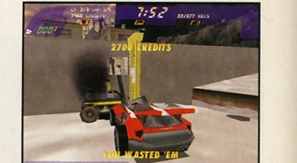 Screenshot: masina distrusa fumegand — "2700 CREDITS", "YOU WASTED 'EM"